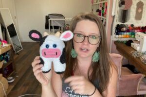 Finished crochet amigurumi cow with pink snout and gray patches by A Crafty Concept