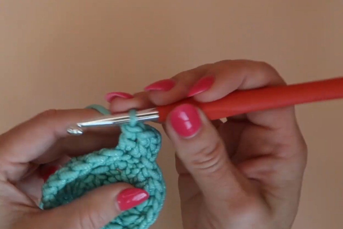 Crocheting the circular base of the dish scrubby in the round