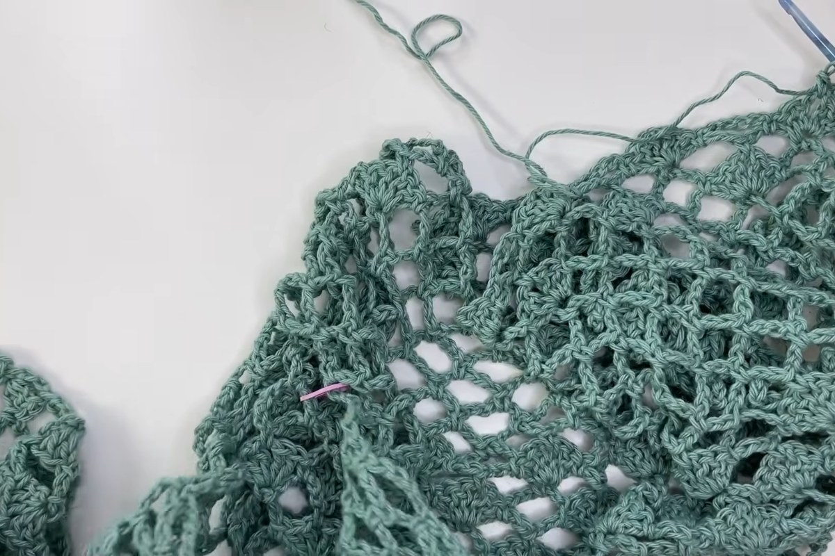The one-piece lace crochet top worked flat with a stitch marker at the neckline