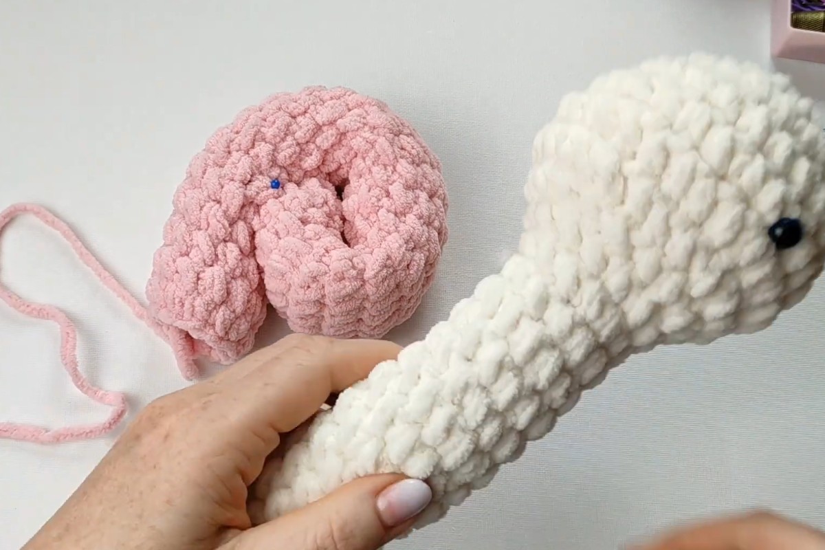 Crochet plush snail body and spiral shell before assembly