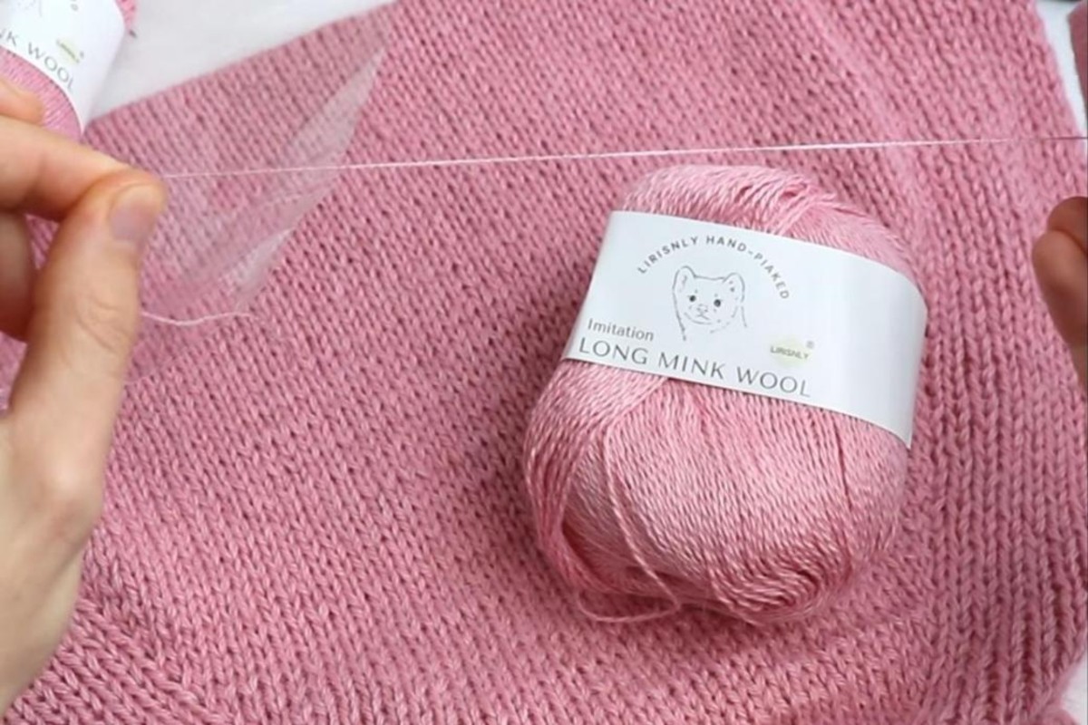 Pink wool-blend yarn and reinforcing thread used for the knit hat-hood