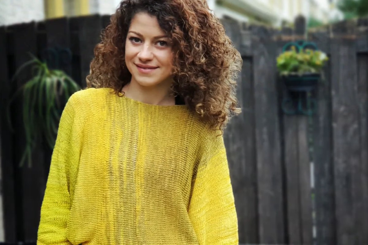 Finished Sunshine Sweater knitted in a yellow self-striping yarn, worn with a relaxed fit