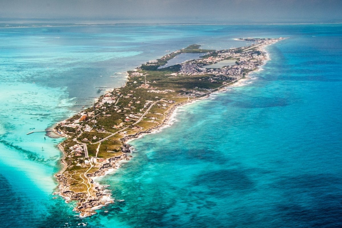 Aerial view of Isla Mujeres surrounded by turquoise sea